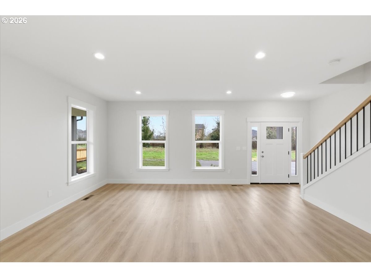 3191 Northwest 23rd Avenue Albany, OR 97321 - Photo 5 of 47 a view of an empty room with wooden floor and windows