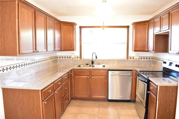 a kitchen with a sink stove and cabinets