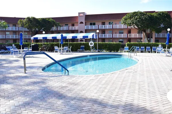 a view of pool with outdoor seating