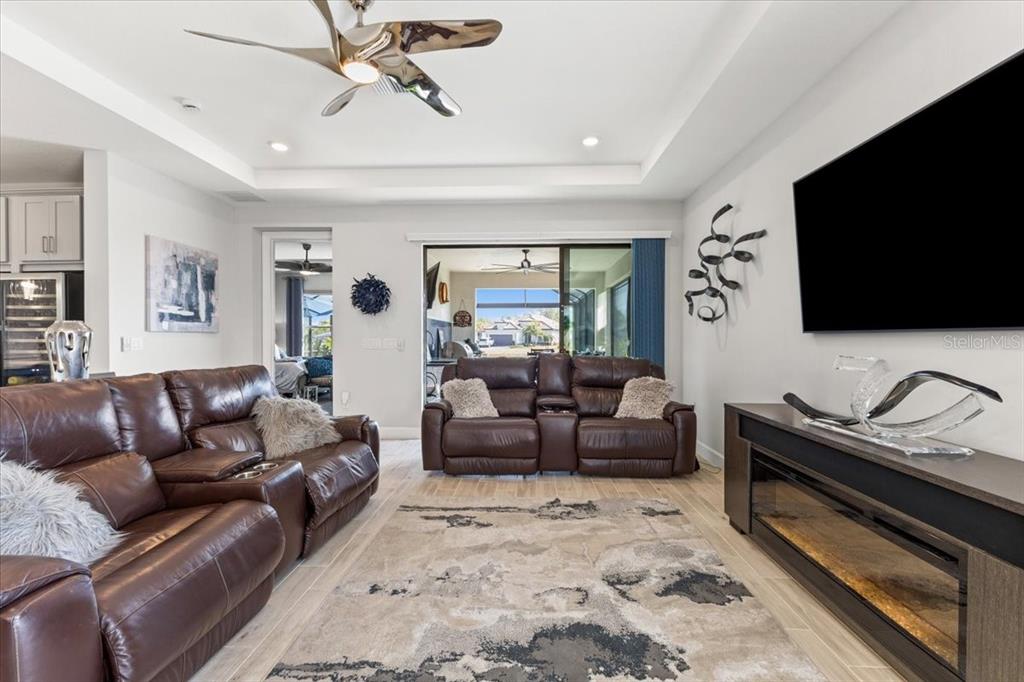 4760 Crestpoint Way Palmetto, FL 34221 - Photo 11 of 44 a living room with furniture and a flat screen tv