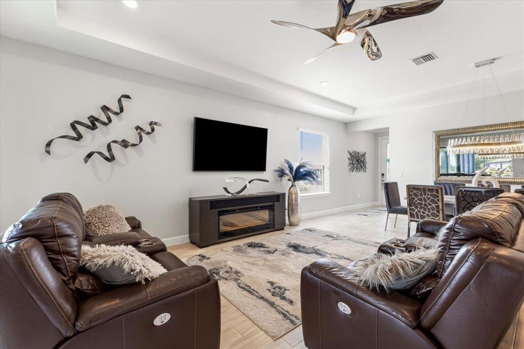 4760 Crestpoint Way Palmetto, FL 34221 - Photo 12 of 44 a living room with furniture and a flat screen tv