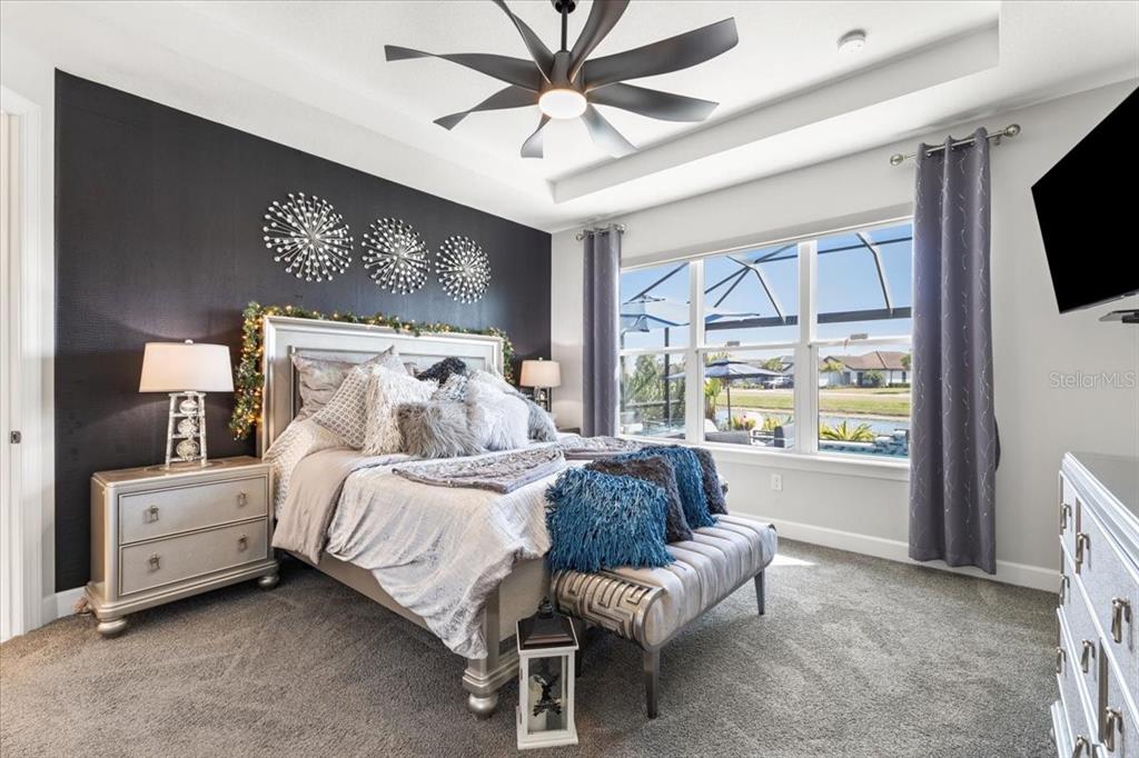 4760 Crestpoint Way Palmetto, FL 34221 - Photo 14 of 44 a bed room with a bed and a television