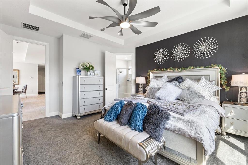 4760 Crestpoint Way Palmetto, FL 34221 - Photo 15 of 44 a bed room with a bed and a television