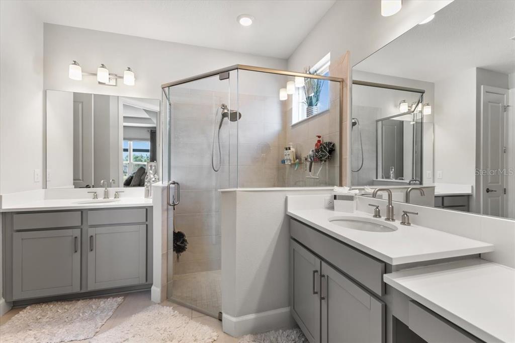 4760 Crestpoint Way Palmetto, FL 34221 - Photo 16 of 44 a bathroom with a double vanity sink mirror and double