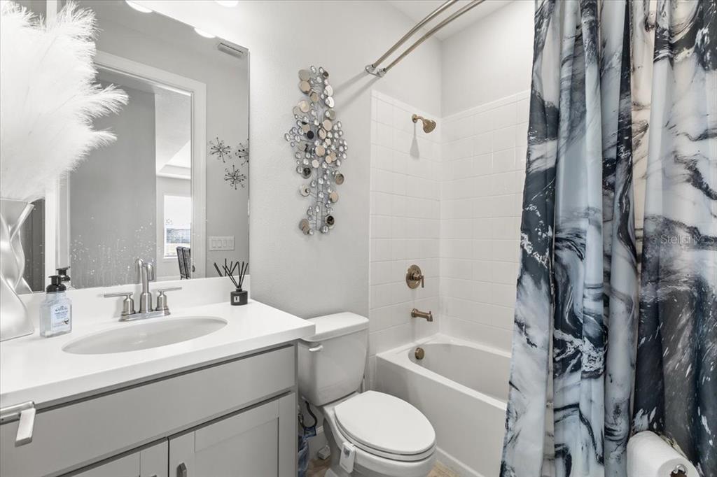 4760 Crestpoint Way Palmetto, FL 34221 - Photo 19 of 44 a bathroom with a sink toilet and shower