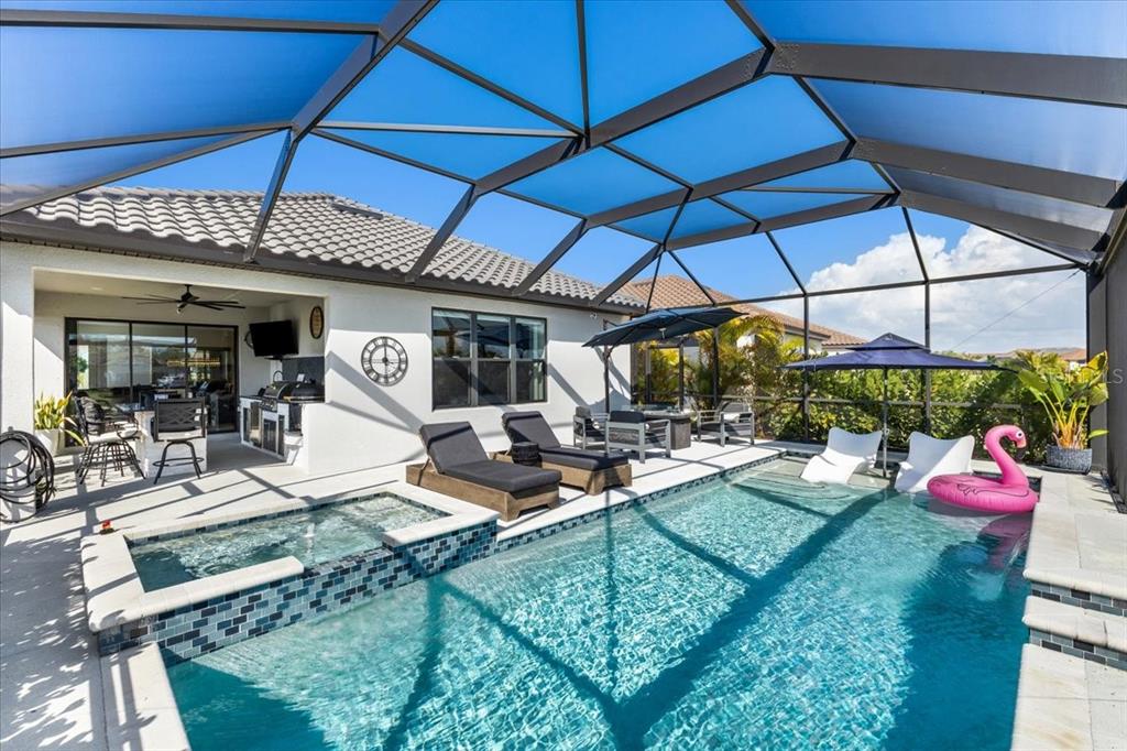 4760 Crestpoint Way Palmetto, FL 34221 - Photo 27 of 44 a view of a backyard with a patio and wooden floor
