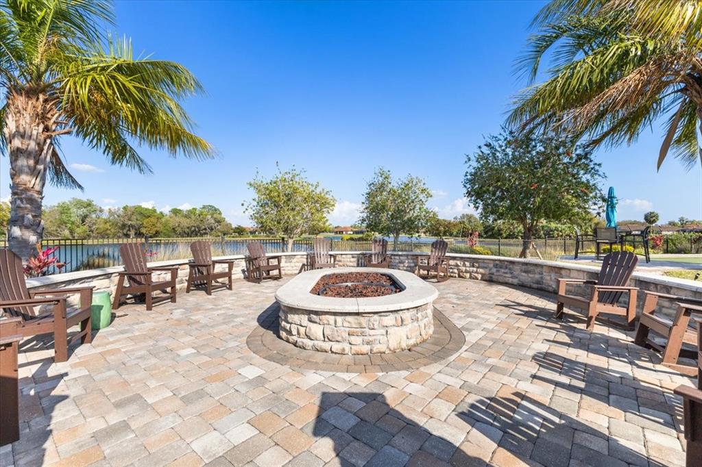 4760 Crestpoint Way Palmetto, FL 34221 - Photo 31 of 44 a roof deck with a table and chairs