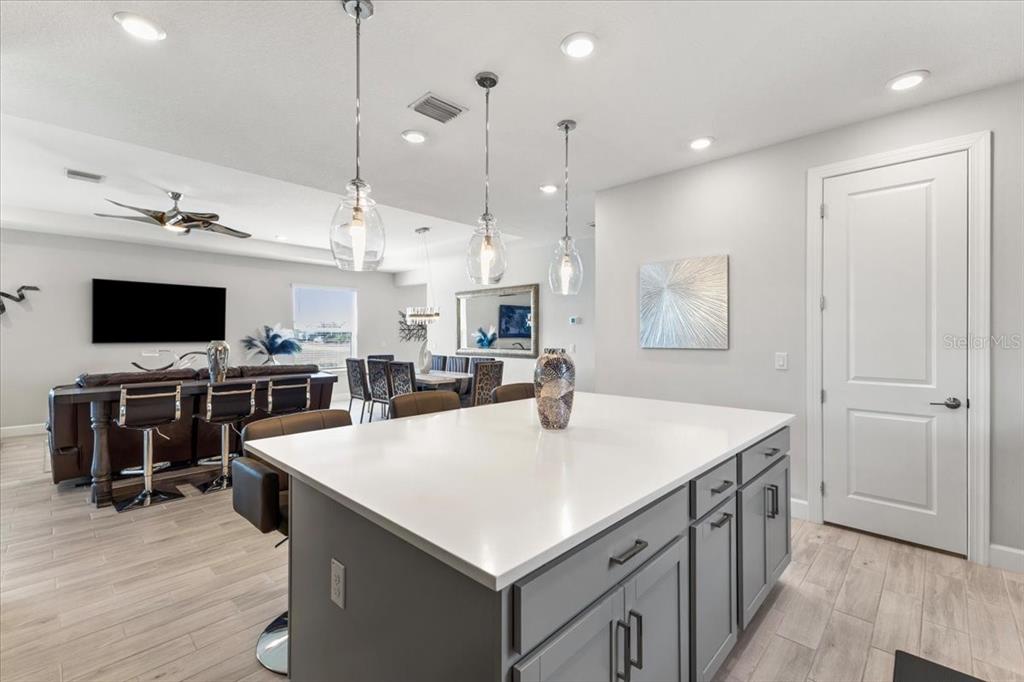 4760 Crestpoint Way Palmetto, FL 34221 - Photo 9 of 44 a kitchen with stainless steel appliances granite countertop a sink and a refrigerator