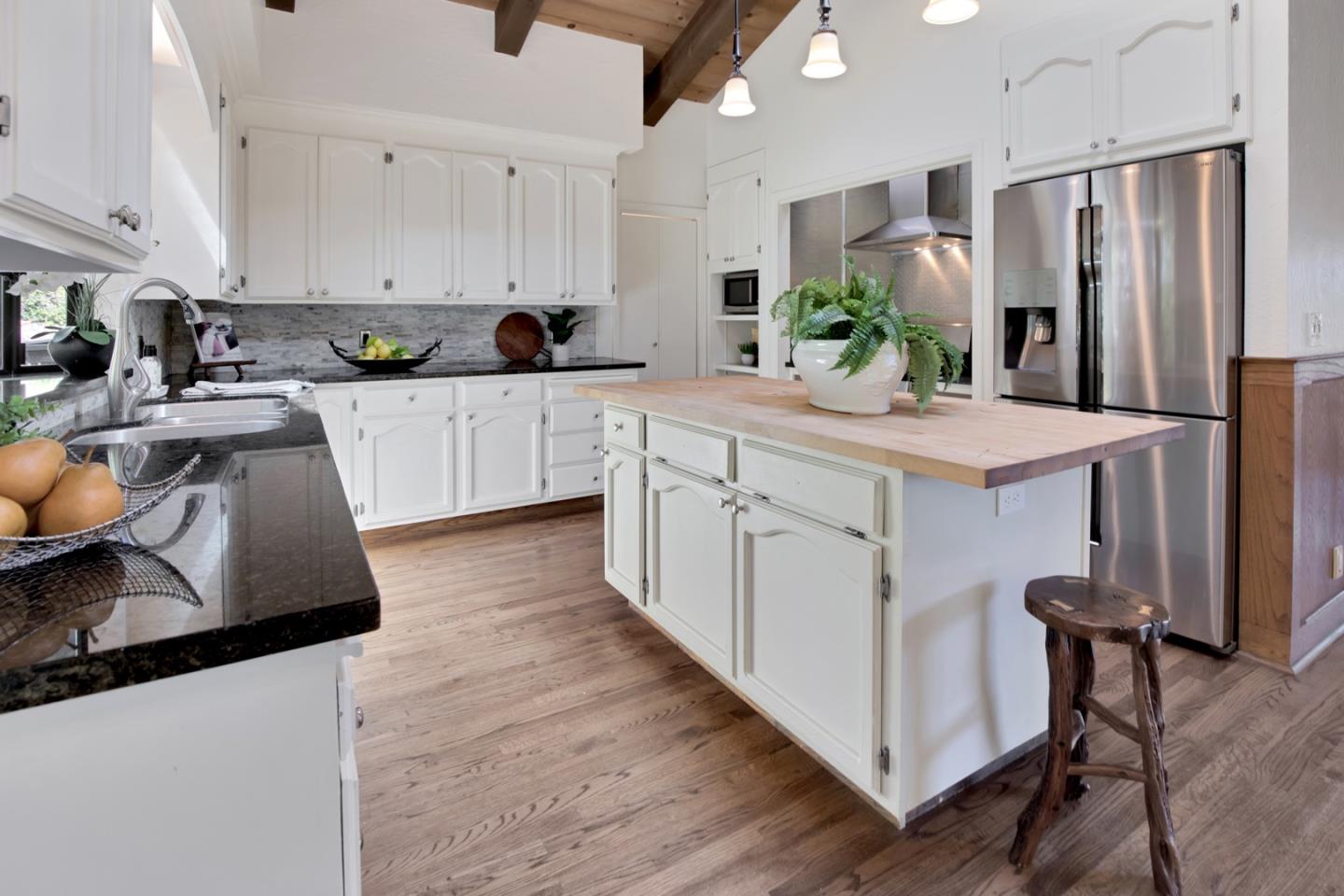 560 Hidden Valley Road Soquel, CA 95073 - Photo 11 of 59 a kitchen with stainless steel appliances a sink stove refrigerator and cabinets