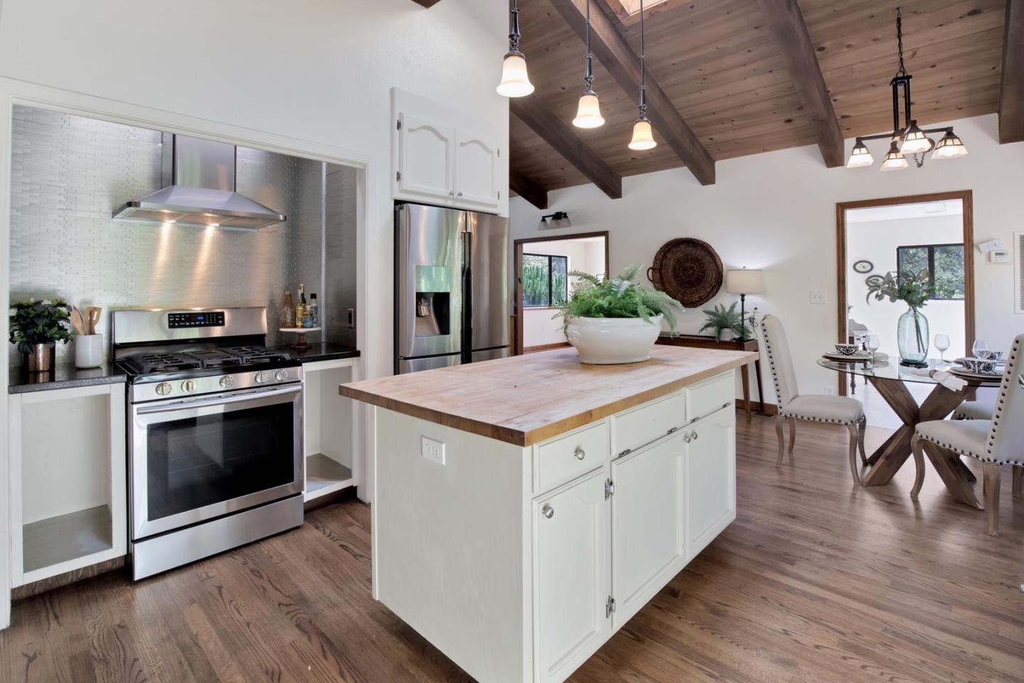 560 Hidden Valley Road Soquel, CA 95073 - Photo 12 of 59 a kitchen with a stove and a wooden floor