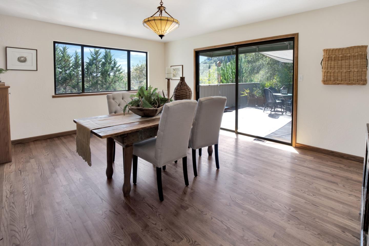 560 Hidden Valley Road Soquel, CA 95073 - Photo 15 of 59 a view of a dining room with furniture window and wooden floor