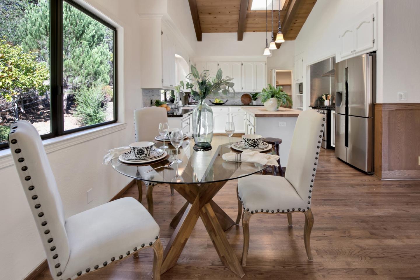 560 Hidden Valley Road Soquel, CA 95073 - Photo 16 of 59 a view of a dining room with furniture window and wooden floor