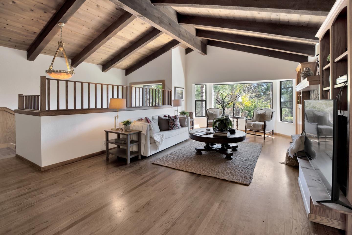 560 Hidden Valley Road Soquel, CA 95073 - Photo 19 of 59 a living room with furniture and a flat screen tv