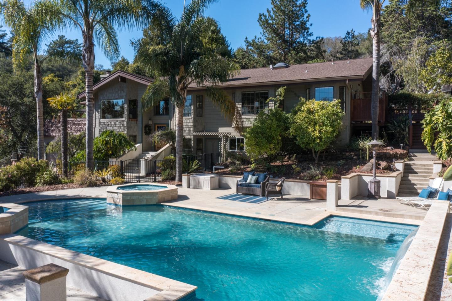 560 Hidden Valley Road Soquel, CA 95073 - Photo 2 of 59 a view of a house with patio and a garden