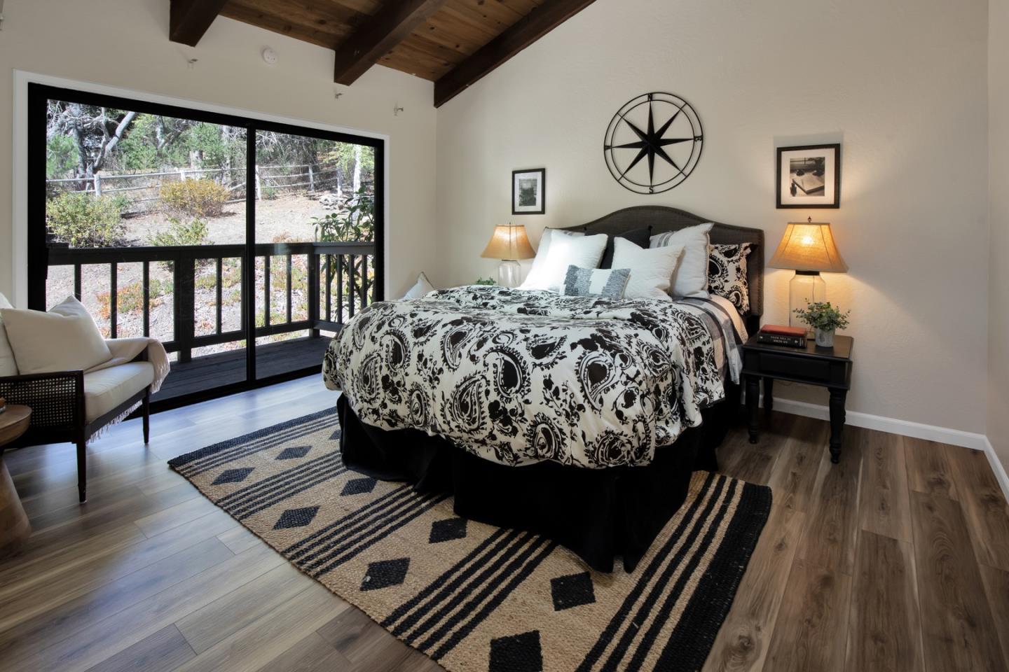 560 Hidden Valley Road Soquel, CA 95073 - Photo 30 of 59 a bed sitting in a bedroom next to a window