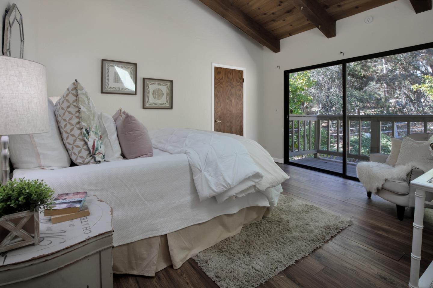 560 Hidden Valley Road Soquel, CA 95073 - Photo 33 of 59 a bedroom with a large bed and a large window