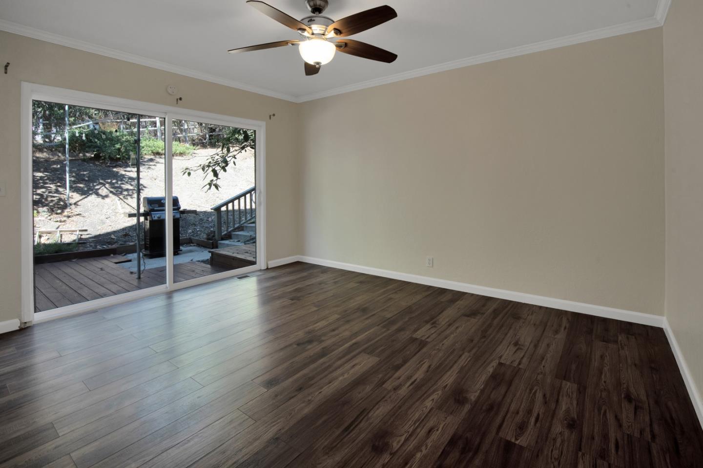 560 Hidden Valley Road Soquel, CA 95073 - Photo 34 of 59 a view of an empty room with wooden floor and a window