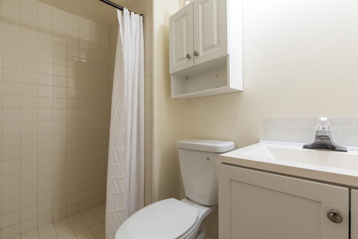560 Hidden Valley Road Soquel, CA 95073 - Photo 43 of 59 a bathroom with a sink a toilet and a mirror