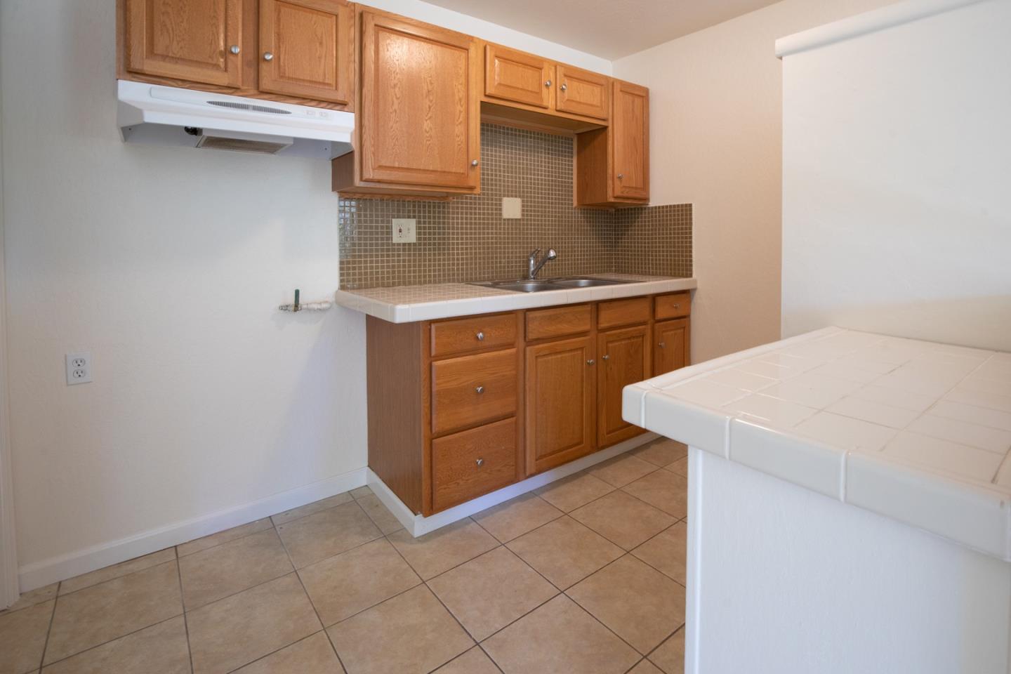560 Hidden Valley Road Soquel, CA 95073 - Photo 44 of 59 a kitchen with a sink and cabinets