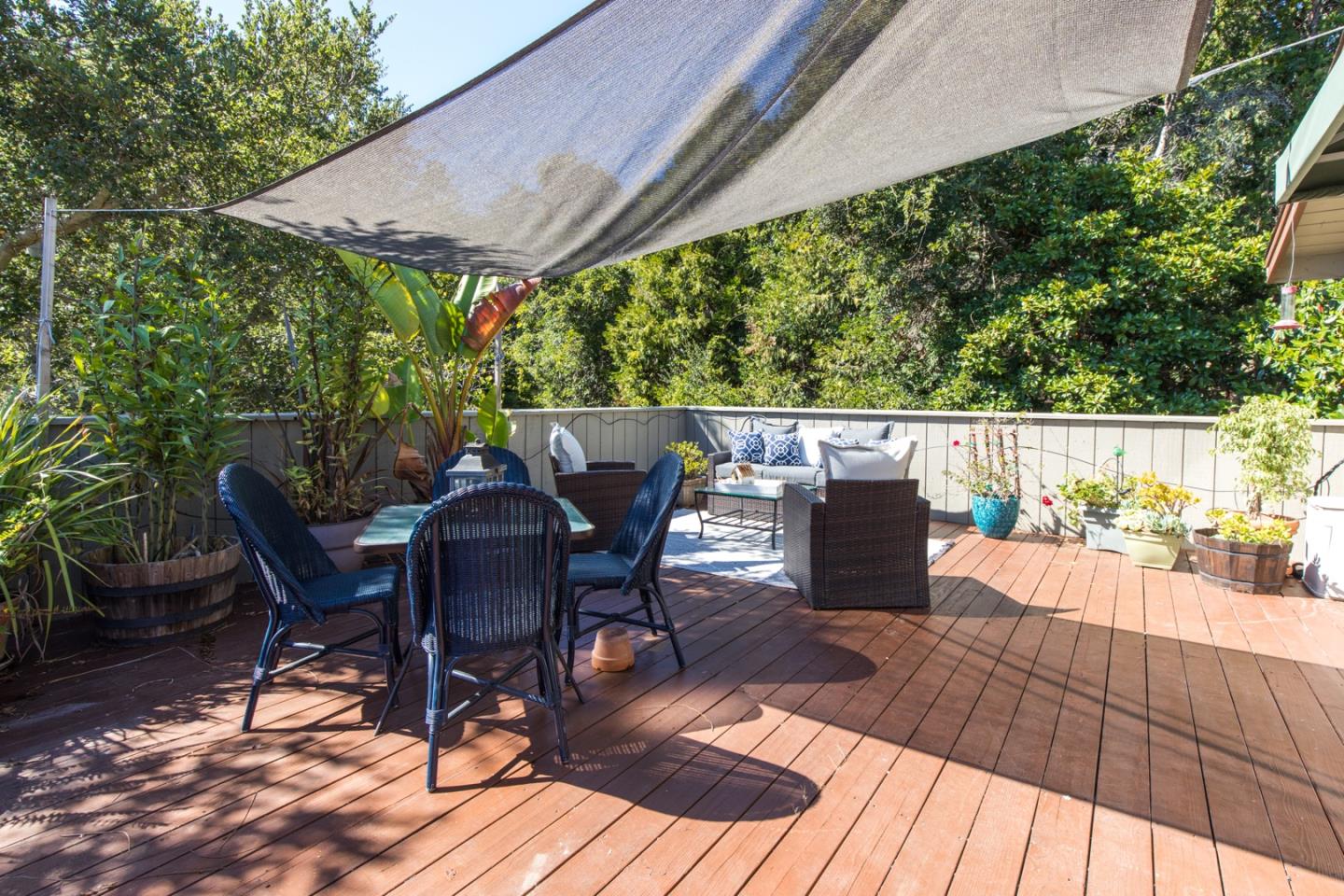 560 Hidden Valley Road Soquel, CA 95073 - Photo 50 of 59 a view of a patio with table and chairs and wooden floor