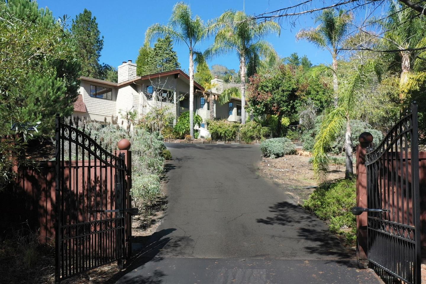 560 Hidden Valley Road Soquel, CA 95073 - Photo 7 of 59 a front view of a house with a yard and tree s