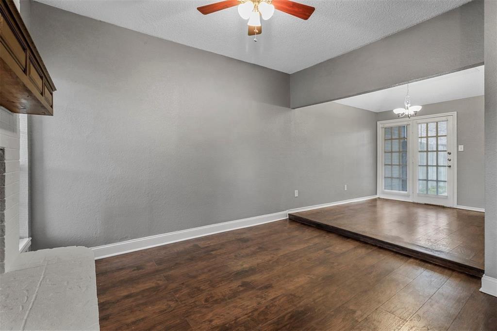 814 Custer Street Arlington, TX 76014 - Photo 8 of 17 an empty room with windows and cabinet