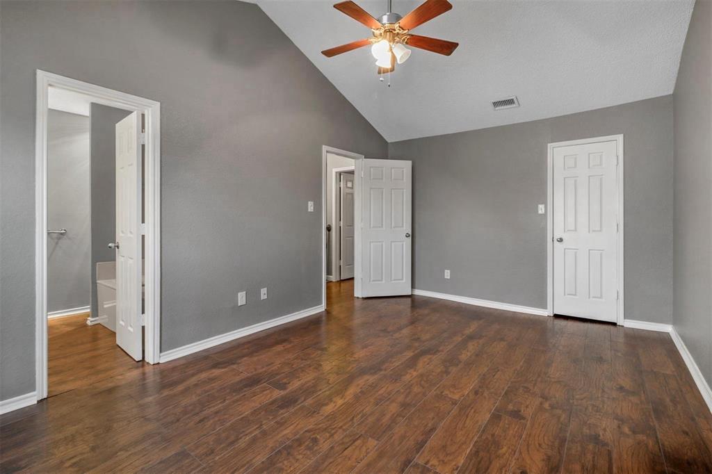 814 Custer Street Arlington, TX 76014 - Photo 10 of 17 a view of an empty room with wooden floor
