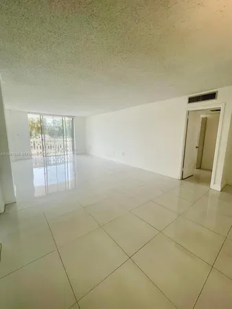 an empty room with a bathroom