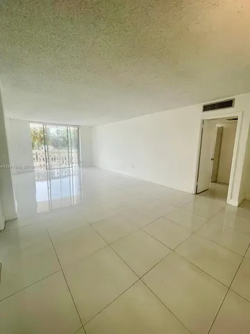 an empty room with a bathroom