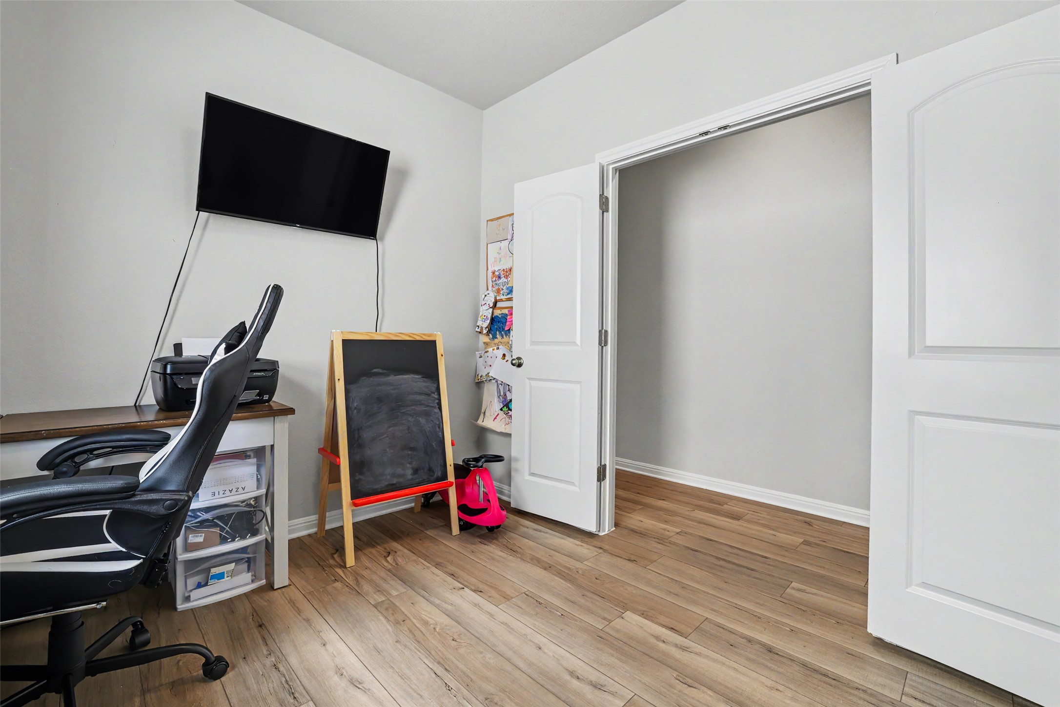 112 Rocking R Court Georgetown, TX 78633 - Photo 32 of 40 A well-lit, versatile study or den, featuring durable wood-look flooring and ample closet space.