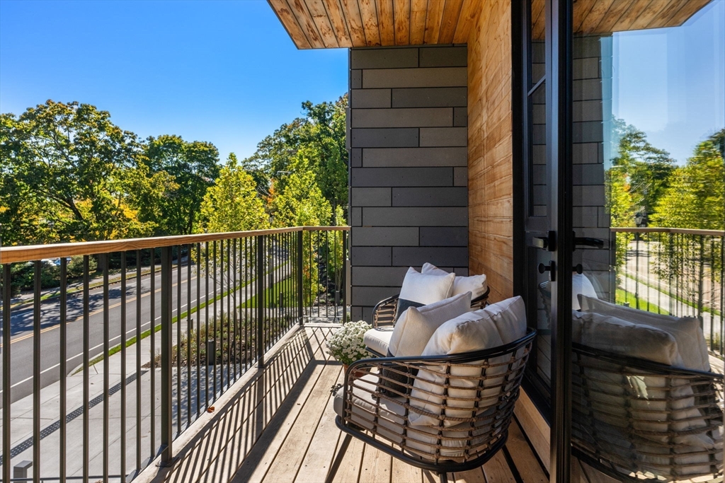 100 Linden Street, Unit 106 Wellesley, MA 02482 - Photo 11 of 28 a balcony view with a seating space