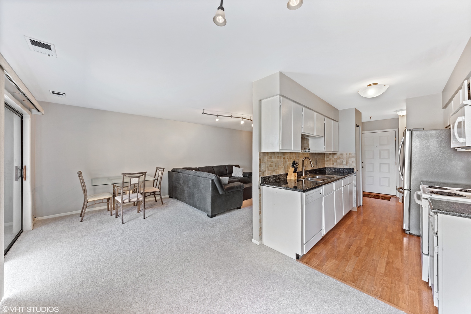 1400 North Elmhurst Road, Unit 203 Mount Prospect, IL 60056 - Photo 5 of 13 a kitchen with sink cabinets and refrigerator