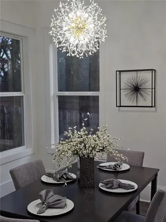a living room with furniture and a lamp