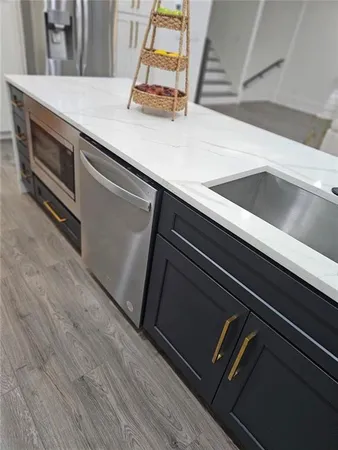 a close view of sink and washing machine
