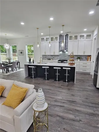 a living room with furniture and flat screen tv