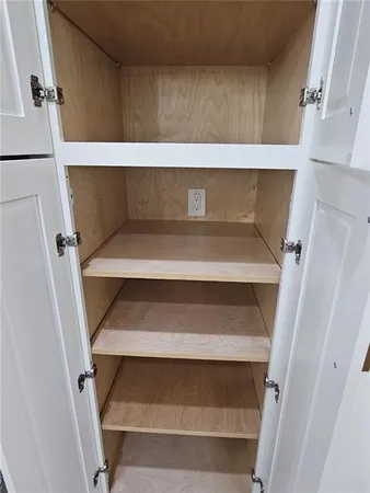 a stove sitting inside of a kitchen