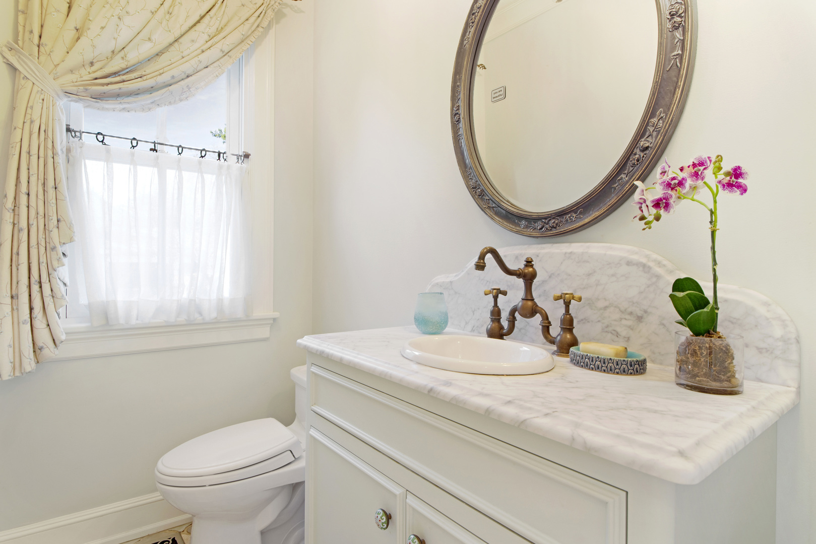 1380 Elm Tree Road Lake Forest, IL 60045 - Photo 13 of 43 a bathroom with a sink and a mirror