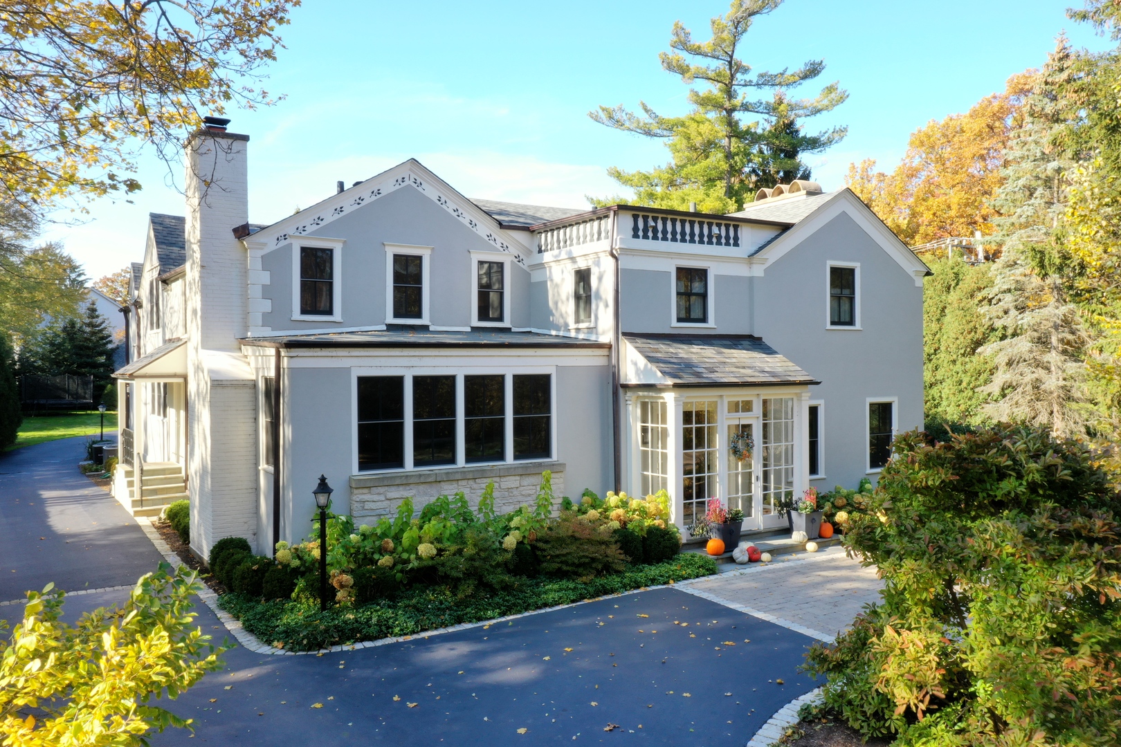 1380 Elm Tree Road Lake Forest, IL 60045 - Photo 3 of 43 a front view of a house with a garden