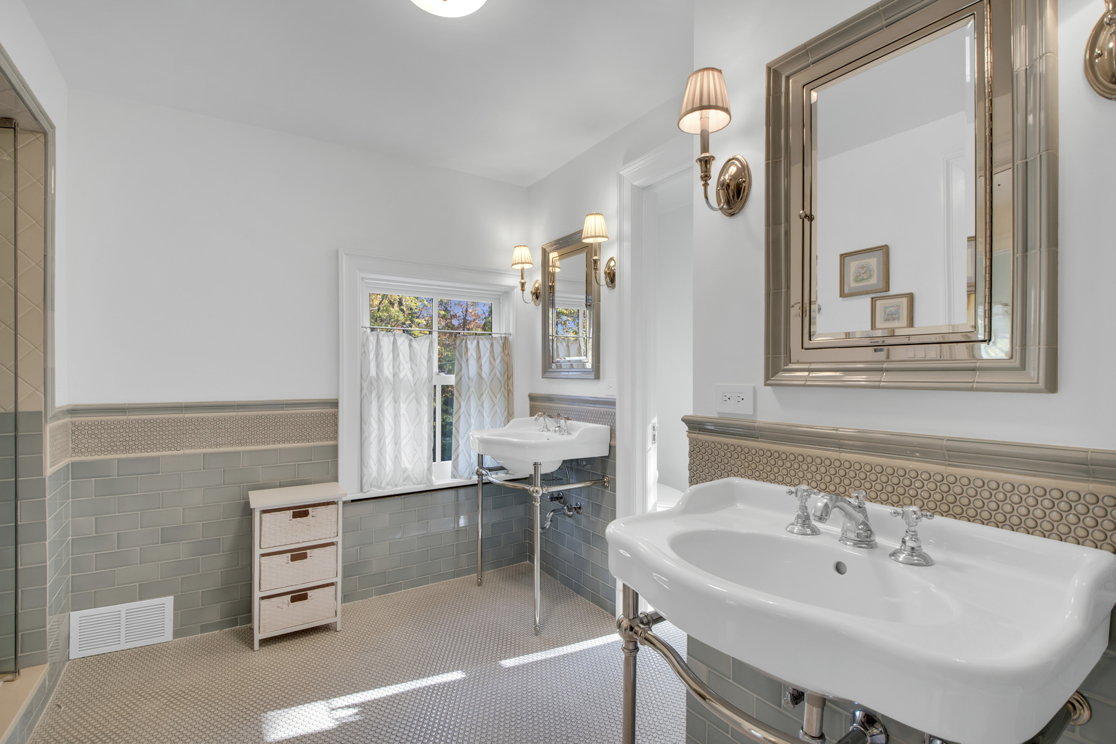 1380 Elm Tree Road Lake Forest, IL 60045 - Photo 33 of 43 a bathroom with a sink a mirror and a shower
