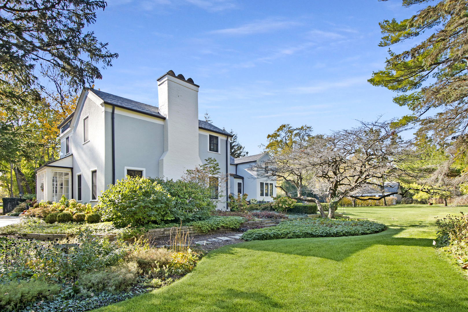 1380 Elm Tree Road Lake Forest, IL 60045 - Photo 34 of 43 a front view of a house with garden