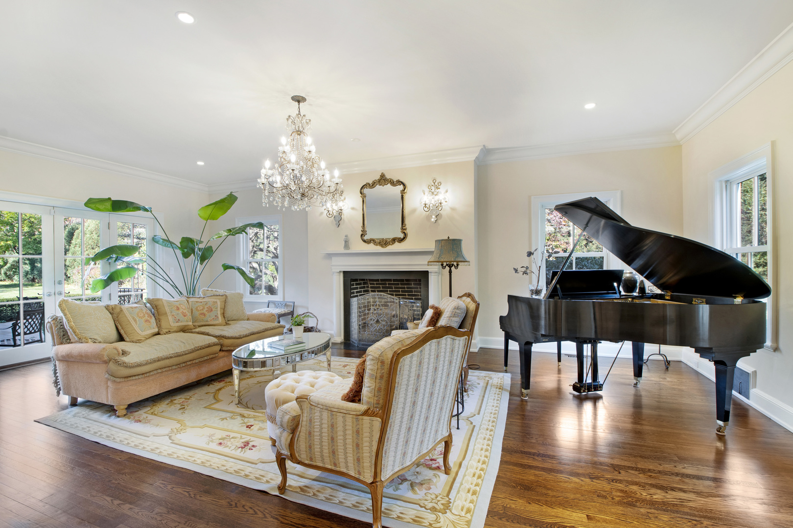 1380 Elm Tree Road Lake Forest, IL 60045 - Photo 6 of 43 a living room with furniture and a chandelier