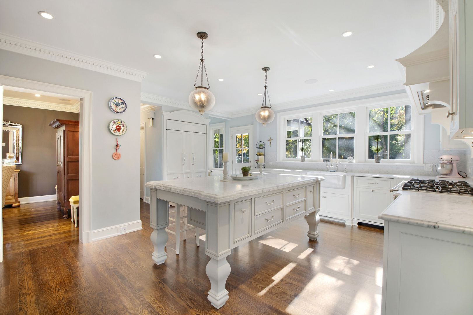 1380 Elm Tree Road Lake Forest, IL 60045 - Photo 9 of 43 a kitchen with stainless steel appliances granite countertop a sink stove and wooden floor