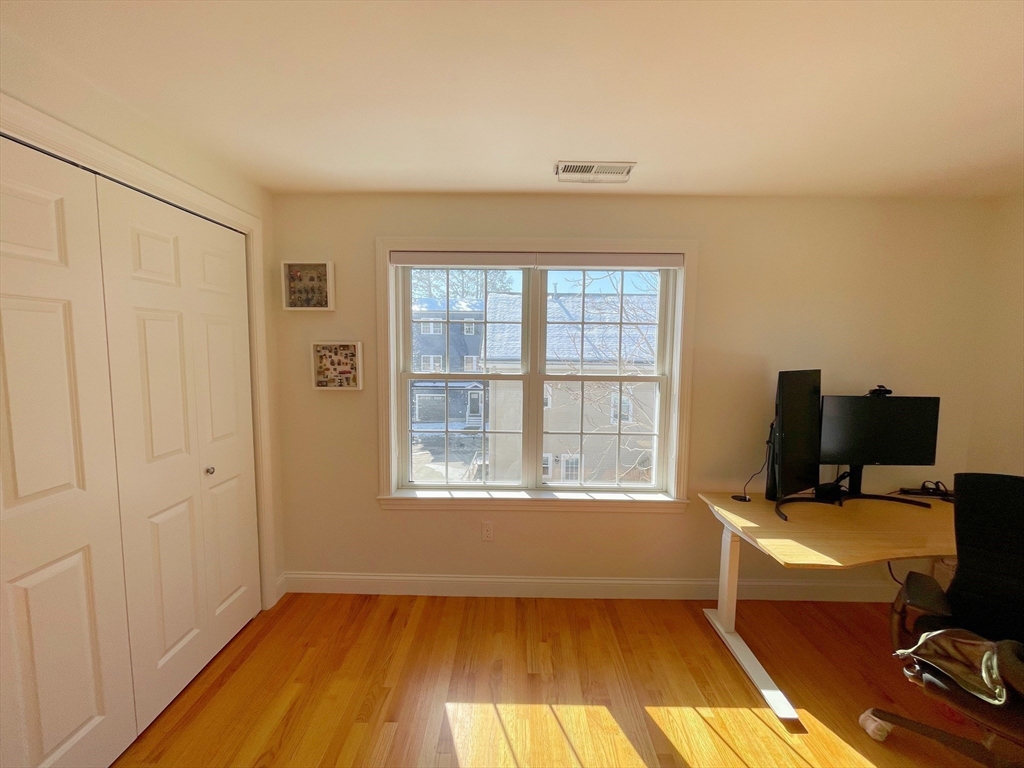12 Naviens Lane, Unit 1 Waltham, MA 02453 - Photo 9 of 12 a view of a workspace with furniture and a window
