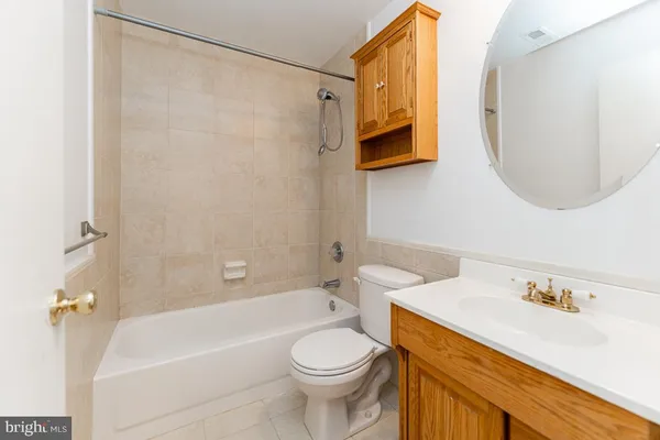 a bathroom with a sink a toilet and a bathtub