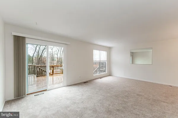 an empty room with entrance door