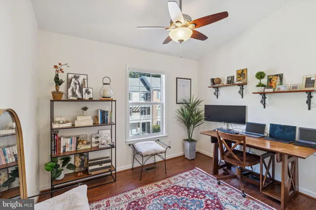 a workspace with furniture and window