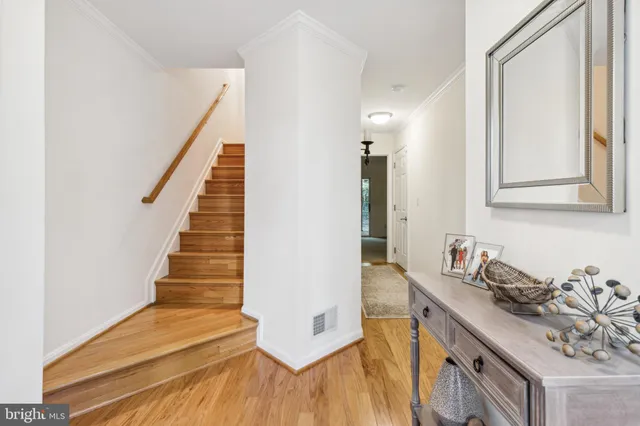 a kitchen with sink cabinets and wooden floor