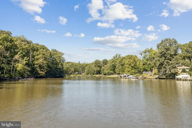 a view of a lake with houses in the back