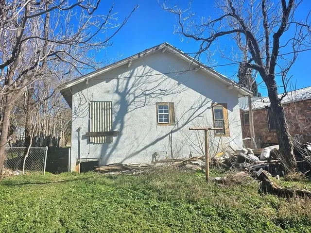 a house view with a backyard space