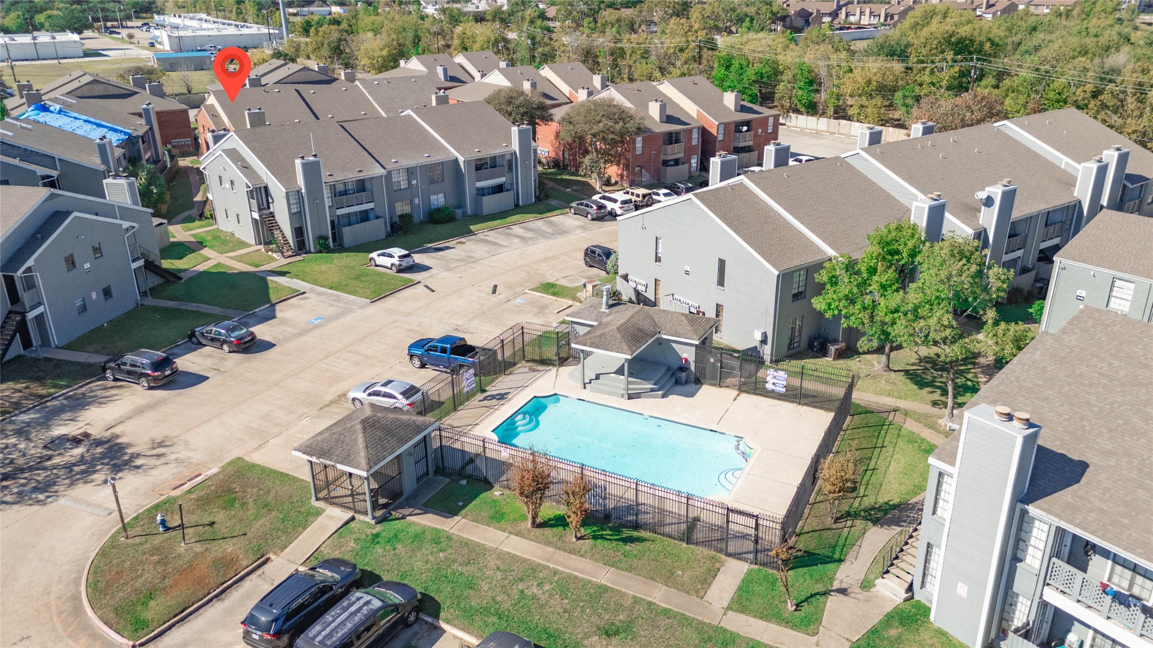 an aerial view of a house with yard